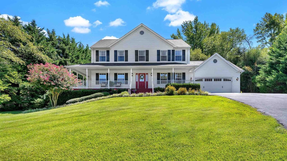 Colonial style home with a wide front lawn in Prince Frederick, Maryland