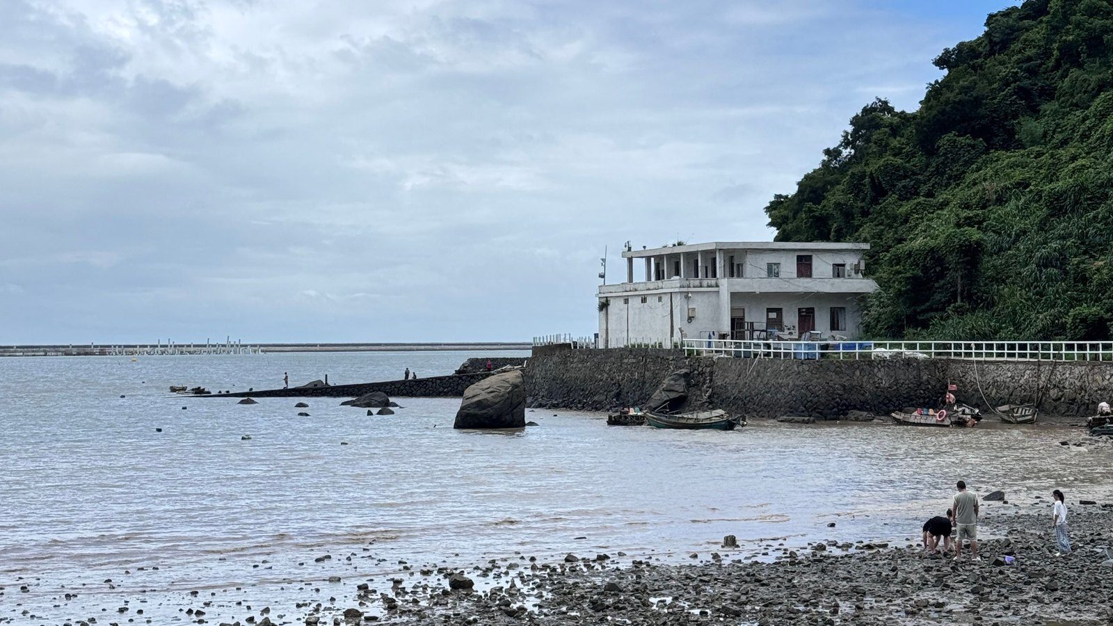 Rocky protected shoreline and waterfront home representing Calvert County shoreline stabilization records