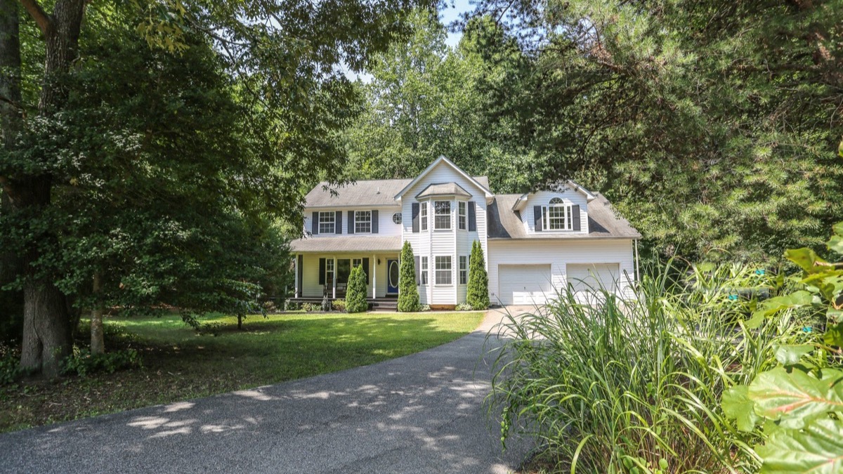 A Calvert County home with a long driveway being prepared for listing