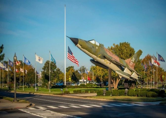 Base entrance with flags flying, representing NAS Patuxent River in St. Mary's County Maryland