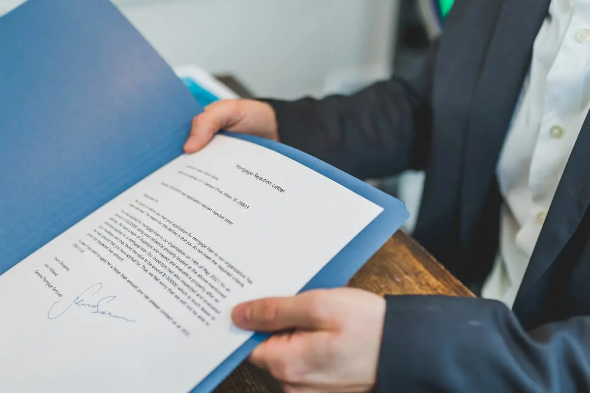 A Maryland real estate contract being negotiated at a settlement table.